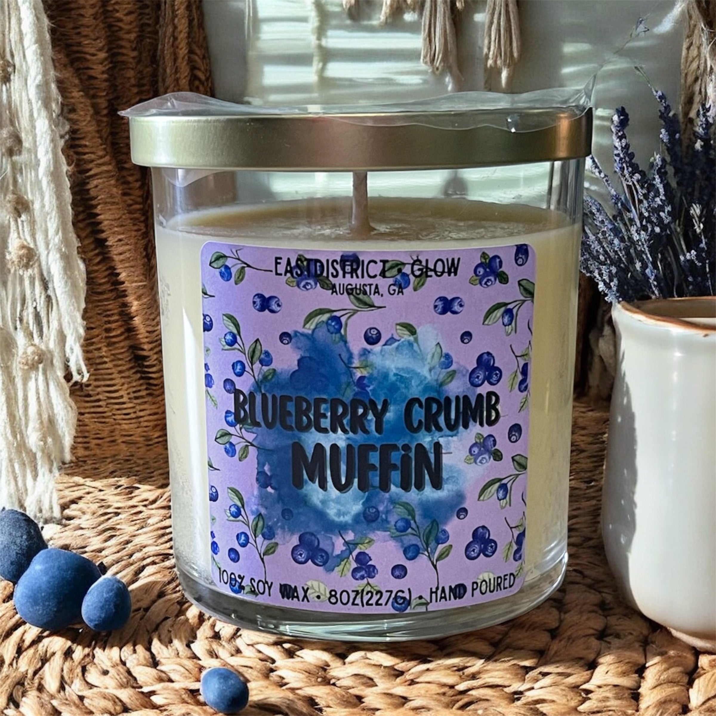 Hand-poured bakery candle with blueberries, sugar, and warm muffin aroma. 