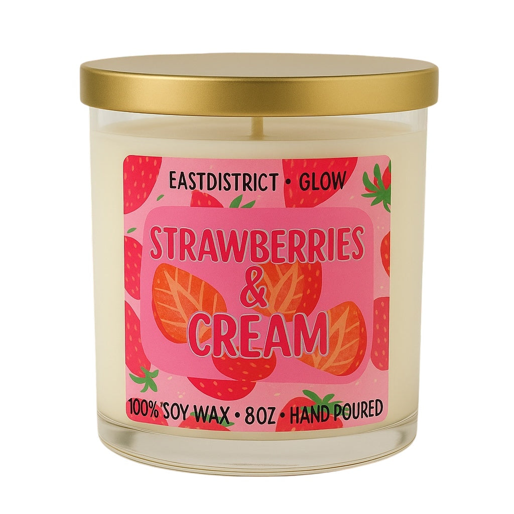 Hand-poured soy candle in clear 8oz glass jar with gold lid. Strawberries and cream fragrance.