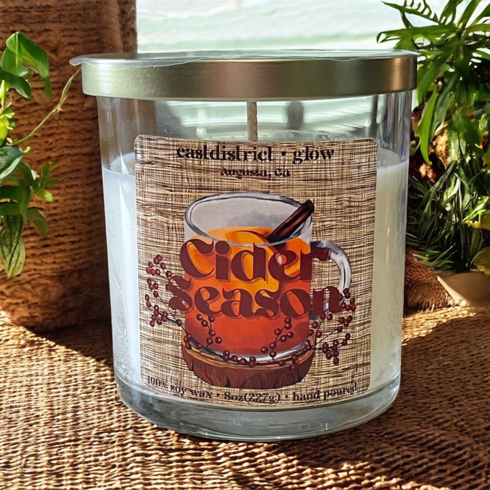 Cider season soy candle in clear glass 8oz jar with gold lid. Apple cider and cinnamon scent.