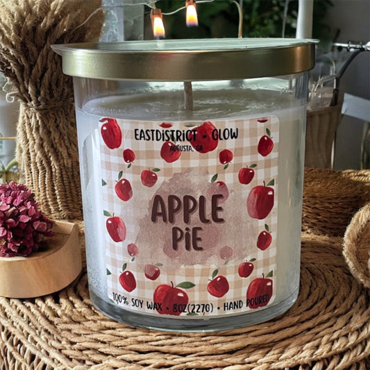 Apple pie soy candle in clear glass jar with gold lid. Fresh baked apple and cinnamon scent. 